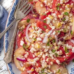 This PEACH TOMATO CORN SALAD WITH SPICY HONEY VINAIGRETTE is so fresh, delicious, and easy. Make it as a side or a meal, its delicious throughout the day. SO MUCH FLAVOR.