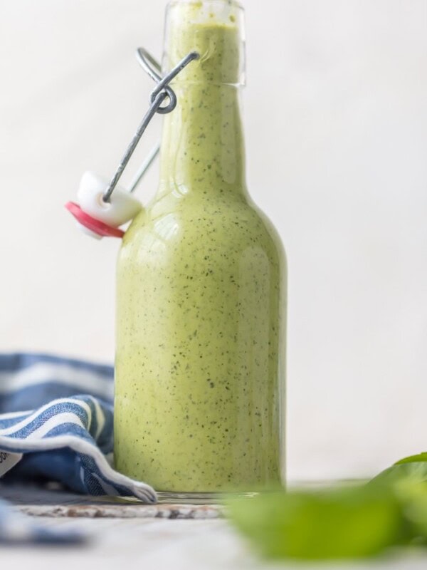 Peruvian Green Sauce (Aji Sauce) is our go-to sauce for anything and everything. We love this Peruvian Green Sauce Recipe on chicken, steak, grilled veggies, salad, and more. SO DARN GOOD. Aji Verde (Green Sauce) is loaded with jalapenos, basil, parmesan, ginger, honey, garlic, lime, and more!