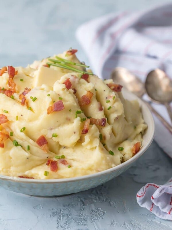 Cheesy Mashed Potatoes with Goat Cheese and Bacon belong on every holiday table! You need these Bacon & Goat Cheese Mashed Potatoes if you're about to entertain friends or family! Bacon Mashed Potatoes are the ultimate side dish. This Mashed Potatoes Recipe is so creamy, flavorful, and delicious. THE BEST cheesy mashed potatoes recipe!