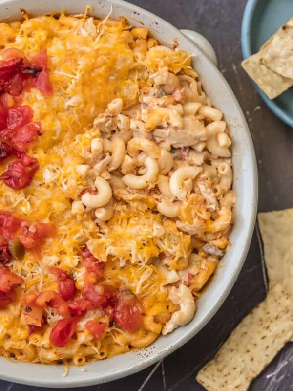 KING RANCH CHICKEN MAC AND CHEESE is a delicious twist on a classic. I wanted to make a fun King Ranch Chicken Recipe that's filled with all those amazing ingredients that I love. This Chicken Mac and Cheese Casserole is loaded with creamy cheese, spicy tomatoes, chunky chicken, and so much more. It will be a family favorite from the first time you make it. 