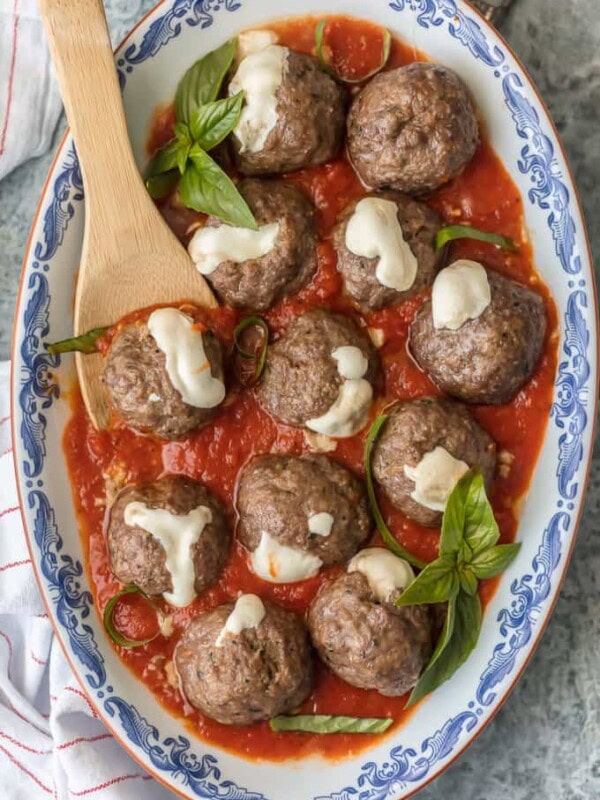 MOZZARELLA STUFFED MEATBALLS are the ultimate appetizer! Theses Italian meatballs are stuffed with whole milk mozzarella and they are oh so juicy and tender. You better make a double batch of these Mozzarella Meatballs if you want them to last! 