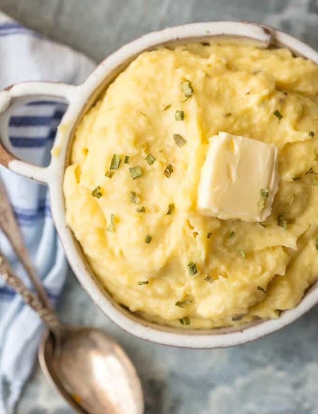 These SLOW COOKER GARLIC BUTTER MASHED POTATOES are the perfect EASY Thanksgiving side dish. So much flavor and none of the fuss.