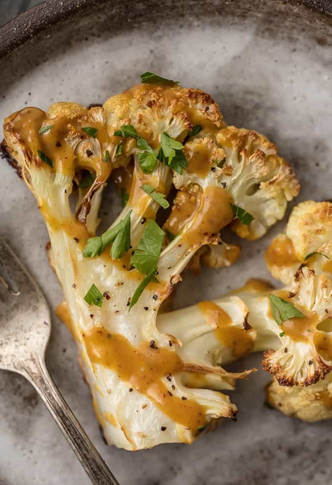 These THAI PEANUT CAULIFLOWER STEAKS are just the right amount of creamy, spicy, and tasty. This easy vegetarian meal or side is always a hit. SO MUCH FLAVOR!