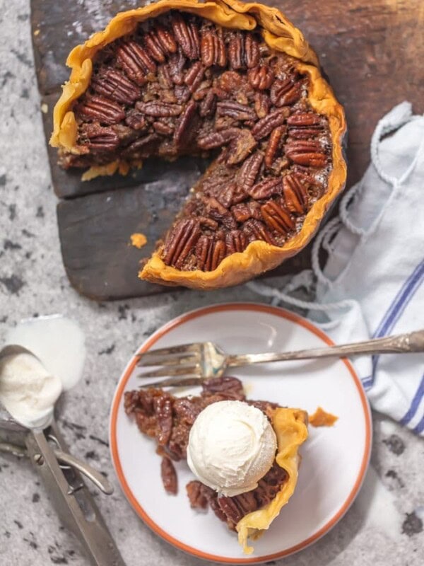 Crock Pot Pecan Pie is such an EASY Pecan Pie Recipe, you won't believe you taste buds! This SLOW COOKER PECAN PIE will knock your socks off and make for a delicious and easy Thanksgiving, Christmas, or Easter! This is the BEST Pecan Pie Recipe we have ever tasted, and it just so happened to be made in a slow cooker. Win win!