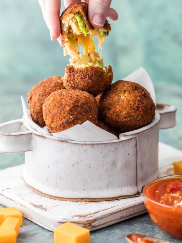 These Arancini Balls with Cheese Bacon and Broccoli are so much easier than you might think. This Arancini Recipe is one of our favorite comfort food appetizers! These cheesy fried rice balls (Arancini Balls) are the ultimate starter to any meal at home. So addicting and delicious!