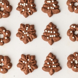 Spritz Cookies are a must make for Christmas. You'd never guess that these CHOCOLATE SPRITZ COOKIES are GLUTEN FREE! Utterly delicious, like little heavenly brownie bites. This Spritz Cookie Recipe is the ultimate EASY Christmas cookie recipe!