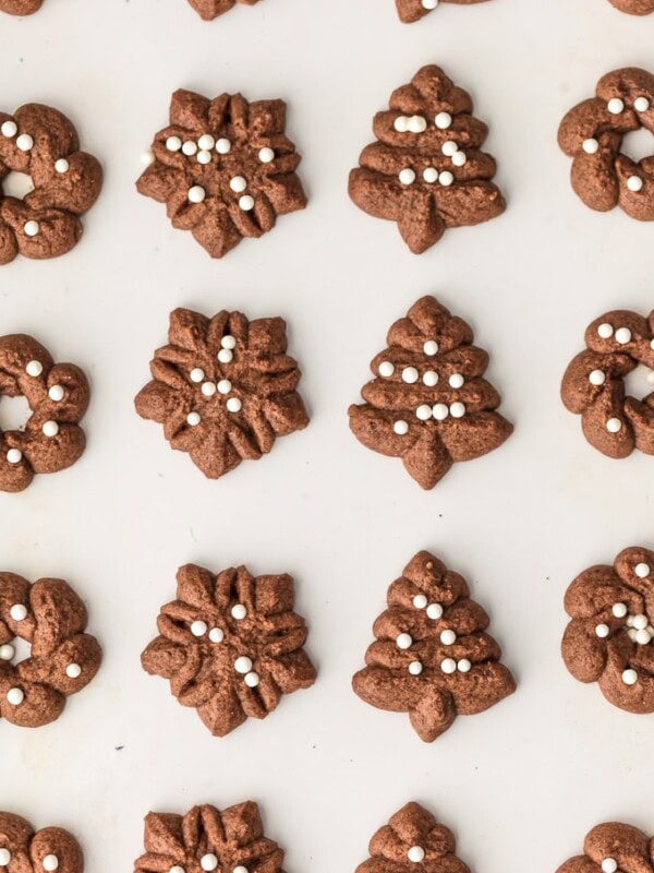 Spritz Cookies are a must make for Christmas. You'd never guess that these CHOCOLATE SPRITZ COOKIES are GLUTEN FREE! Utterly delicious, like little heavenly brownie bites. This Spritz Cookie Recipe is the ultimate EASY Christmas cookie recipe!