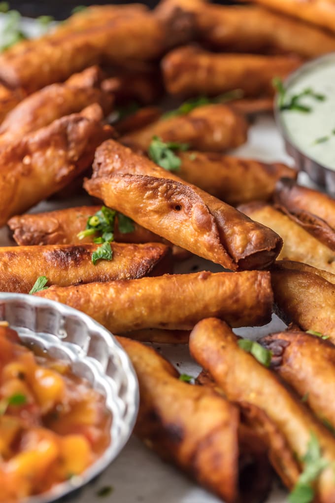 I could eat 50 of these MINI GREEN CHILE CHEESY BEAN TAQUITOS! I just can't get enough. Such a fun and easy appetizer for the holidays or game day. These are always a crowd pleaser.