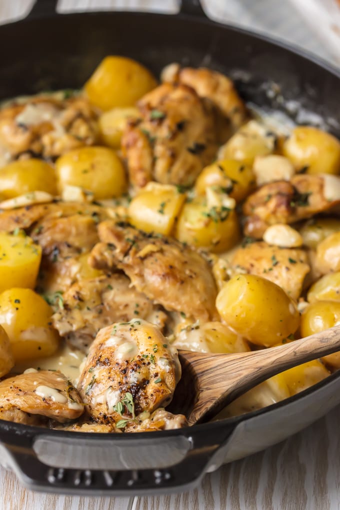 Close up of garlic chicken and potatoes in skillet