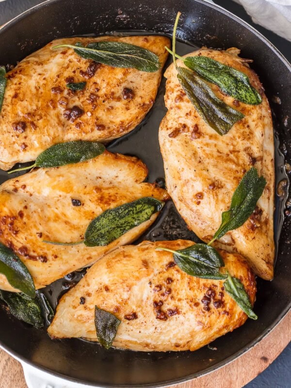 This BRINE CHICKEN BREAST with Garlic and CRISPY SAGE is one of our favorite easy meals for entertaining guests or a delicious night at home. You won't believe how tasty these simple garlic and sage chicken flavors are until you try them all together. The garlic brine makes the chicken SO TENDER and JUICY!