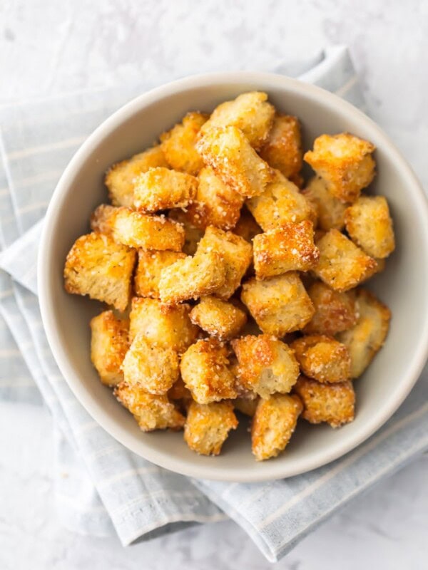 This HOMEMADE CROUTONS RECIPE is super simple.  Impress everyone including yourself with these HEALTHY BAKED CROUTONS! I love that these are BAKED and not fried, making them a healthier alternative to this classic recipe. They're the perfect way to take any salad from good to great. 