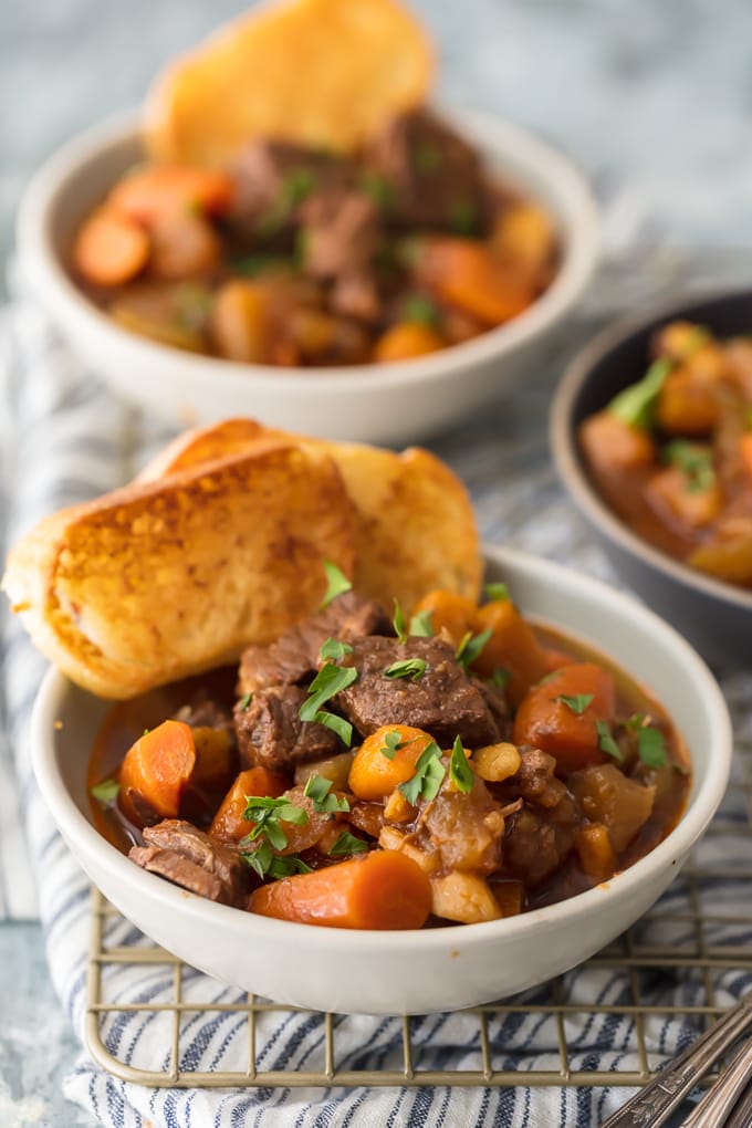 bowls of stew with toasted bread