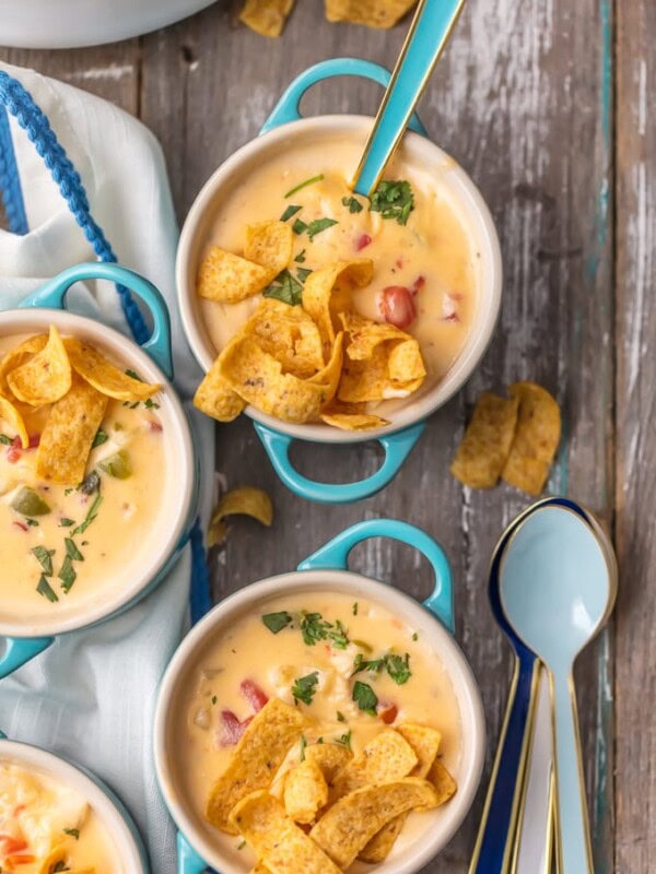 This MEXICAN CHEESY CHICKEN CHOWDER RECIPE is the ultimate Winter comfort food soup! Loaded with spicy tomatoes, green peppers, hash brown potatoes, garlic, onion, CHEESE, and more, this was an instant favorite at our house. Serve this cheesy chicken chowder with Fritos or tortilla chips and you're in business. SO GOOD.