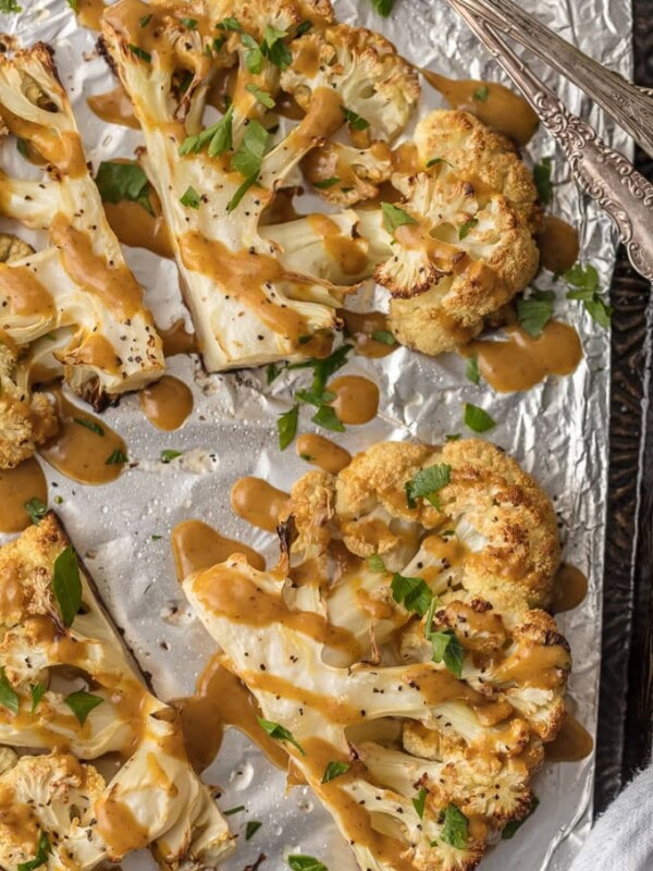 This CAULIFLOWER STEAK RECIPE is a flavorful vegetarian alternative. These THAI PEANUT ROASTED CAULIFLOWER STEAKS are just the right amount of creamy, spicy, and tasty. This easy vegetarian meal or side is always a hit. SO MUCH FLAVOR!