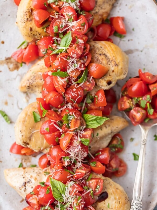 Instant Pot Chicken Bruschetta is a fresh, light, quick, and EASY Instant Pot Chicken Recipe! Bruschetta Chicken with tomatoes, basil, balsamic, and parmesan cheese has always been one of my favorite recipes, and it's only better made in an instant pot! Instant Pot Bruschetta Chicken is one of our go-to easy weeknight meals.