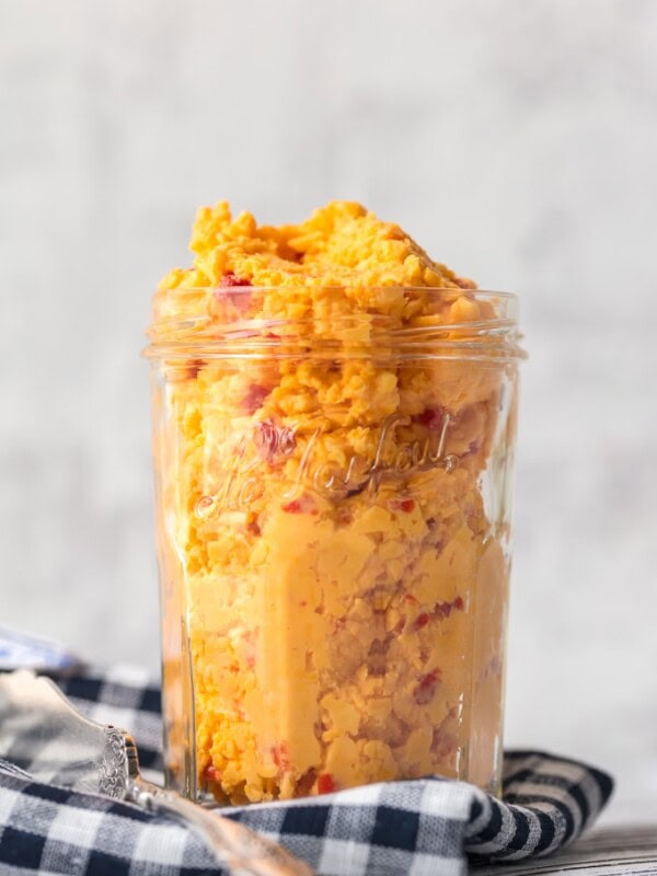 Want to learn How to Make Pimento Cheese? You've come to the right place! This Homemade Pimento Cheese recipe is bold and full of flavor. The classic Southern spread is perfect to serve at parties, and of course it makes an amazing Pimento Cheese Sandwich. With tasty Colby cheese and sweet Pimento peppers, this is the Best Pimento Cheese recipe out there!