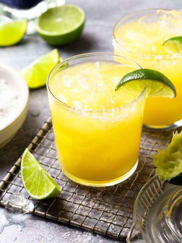 a skinny margarita in a rocks glass with a lime wedge.