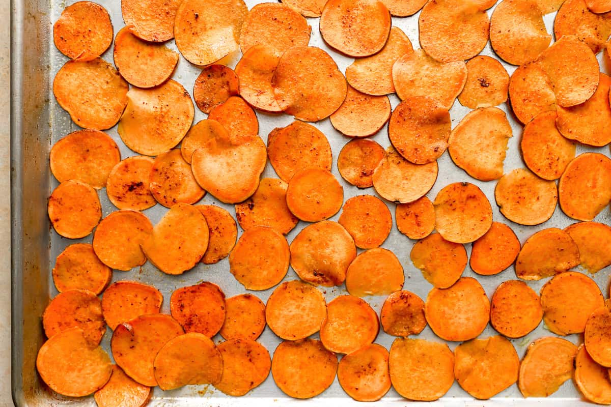 seasoned sweet potato slices on a baking sheet.