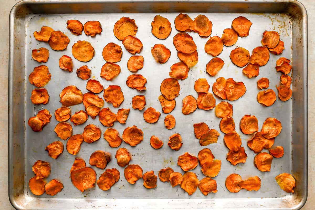 baked sweet potato chips on a baking sheet.