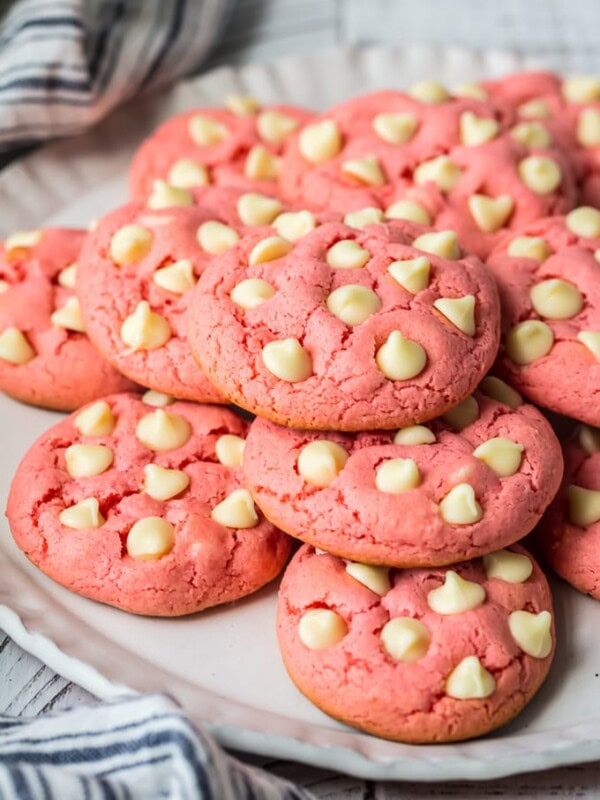 Strawberry Cookies are my favorite Strawberry Cake Mix Cookies! These White Chocolate Strawberry Cake Mix Cookies are so fun and delicious, and so super easy! Fun, festive, and SUPER SIMPLE! Strawberry Cookies with White Chocolate Chips are the perfect Pink Cookies for Valentine's Day, Easter, baby and wedding showers, and beyond! This Cake Mix Cookies Recipe will blow your mind.