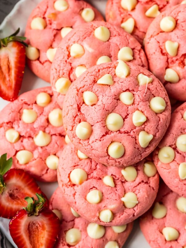 Strawberry Cookies are my favorite Strawberry Cake Mix Cookies! These White Chocolate Strawberry Cake Mix Cookies are so fun and delicious, and so super easy! Fun, festive, and SUPER SIMPLE! Strawberry Cookies with White Chocolate Chips are the perfect Pink Cookies for Valentine's Day, Easter, baby and wedding showers, and beyond! This Cake Mix Cookies Recipe will blow your mind.