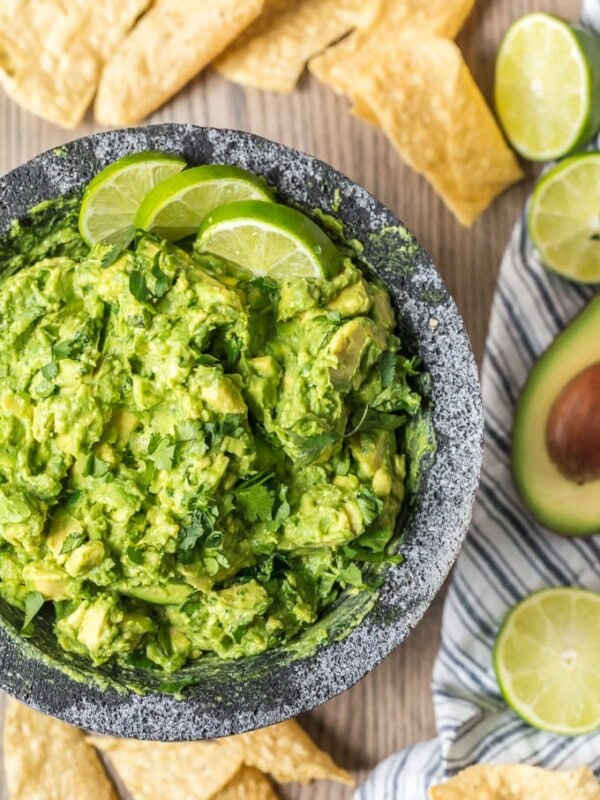 The BEST GUACAMOLE RECIPE EVER! I'm a big fan of Mexican food and dips. So of course I'm obsessed with guacamole too. I cut this Simple Guacamole Recipe down to the basics and it is so fresh. Everything blends together to create the perfect, creamy flavor. This Homemade Guacamole Recipe is my favorite dip for Mexican dinners. I could eat it alll day!