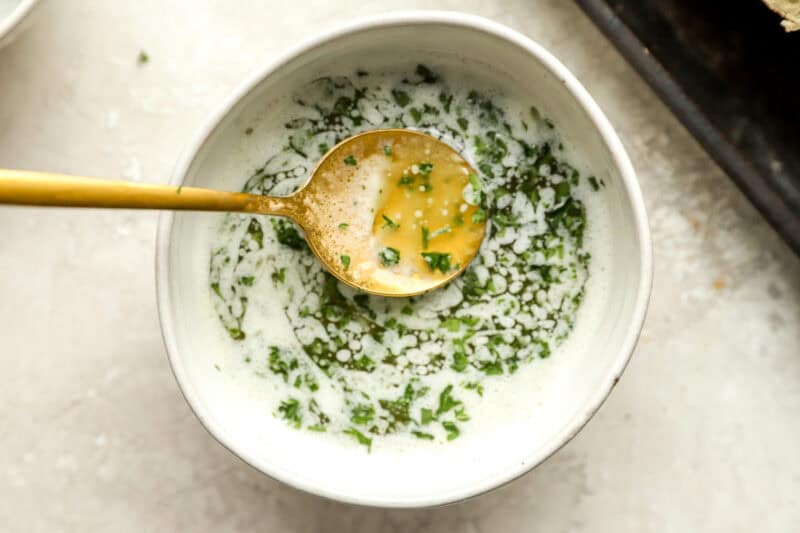 chopped parsley is mixed with garlic butter