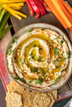 Homemade Hummus is so creamy, so flavorful, and so healthy too! This is a delicious dip you can get away with eating every single day. Learn how to make hummus with the BEST hummus recipe ever. So easy and it tastes good with just about everything!