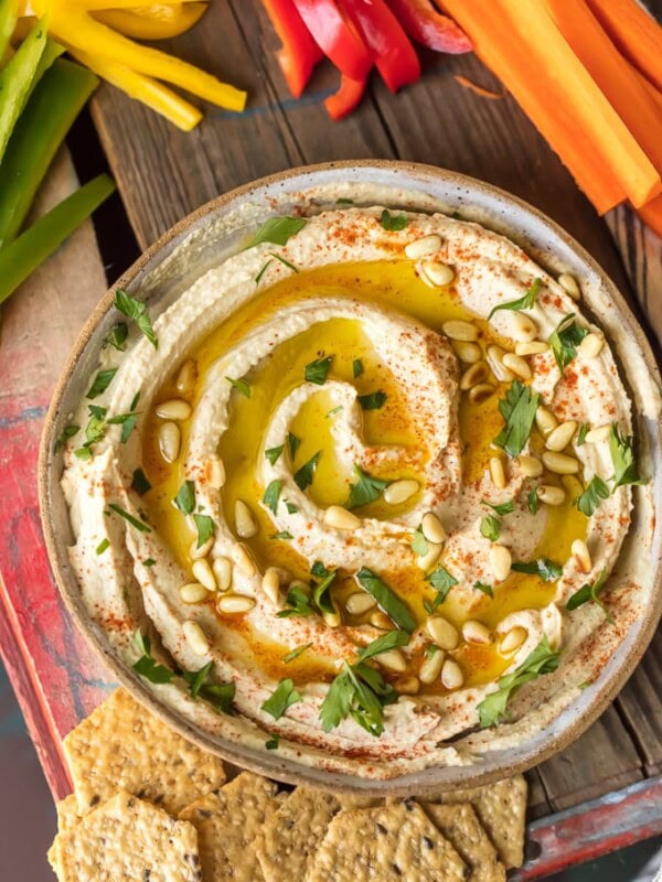 Homemade Hummus is so creamy, so flavorful, and so healthy too! This is a delicious dip you can get away with eating every single day. Learn how to make hummus with the BEST hummus recipe ever. So easy and it tastes good with just about everything!