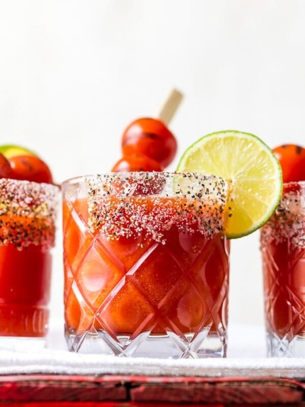 Roasted Tomato Margaritas put a twist on some classic cocktails. Mix the tequila and lime juice of a margarita with the tomato juice of a Bloody Mary, and you've got one fun and delicious drink. This easy margarita recipe is sure to please!