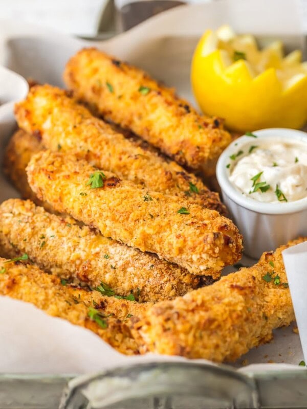 This homemade FISH STICKS recipe is baked instead of fried, making them crispy, tender, & flaky. These baked fish sticks aren't complete without homemade tartar sauce!