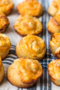 Garlic Cheese Bread Roll Ups are a fun and cheesy recipe that you can serve with any meal. These little garlic rolls are easy to make and so darn delicious!