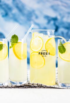 This Homemade Lemonade recipe is as pure & simple as it gets! Make fresh squeezed lemonade all summer long with the perfect recipe.