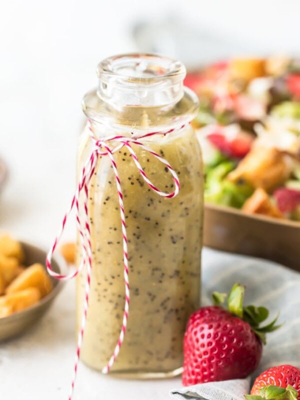 Poppy Seed Dressing is the perfect summer salad dressing. It's light, a little bit sweet, and full of flavor! This homemade poppy seed dressing recipe is super easy to make. It's pairs perfectly with my Strawberry Poppyseed Salad, but it goes well with all kinds of salads. Make some of this poppy seed salad dressing for yourself and dig in to some fresh, tasty salads!