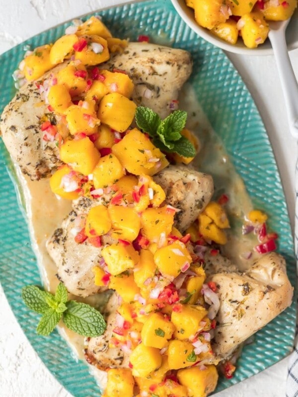 Sangria Chicken with Mango Salsa is a fresh and delicious dinner option. Combine a sangria butter sauce with marinated chicken breasts, and top it off fresh fruity mango salsa. The result is Mango Salsa Chicken, a tasty summer-time dish full of flavor!