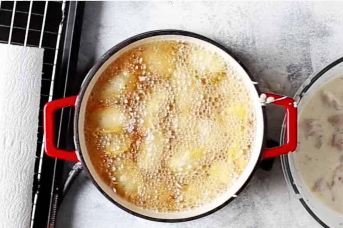 drop the coated chicken cubes in hot oil