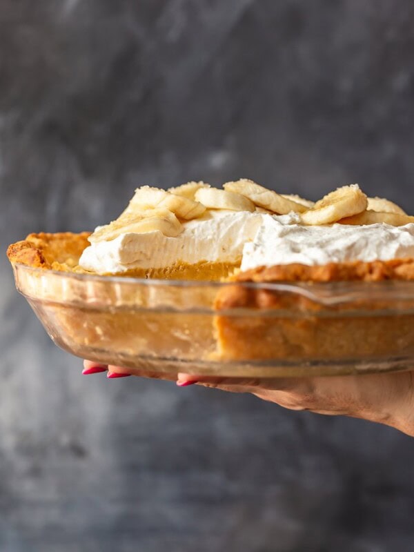 Banana Cream Pie is a creamy, delicious dessert filled with custard and fresh bananas. It's the perfect holiday recipe for Christmas, Easter, or Thanksgiving. This easy banana cream pie recipe is so rich and so tasty, everyone will love it!