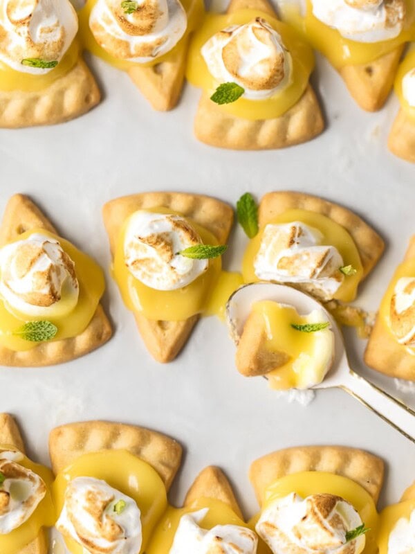 These lemon meringue cookies are a fun, bite-sized version of lemon meringue pie! These easy lemon meringue pie tarts are the perfect dessert to serve at parties!