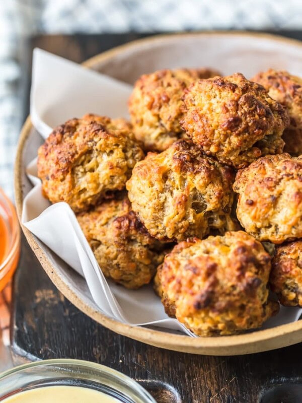 This classic Sausage Balls recipe is savory, cheesy, and tasty! These Bisquick sausage balls are the perfect appetizer for holidays or game day. Serve them with apricot sweet chili dipping sauce!