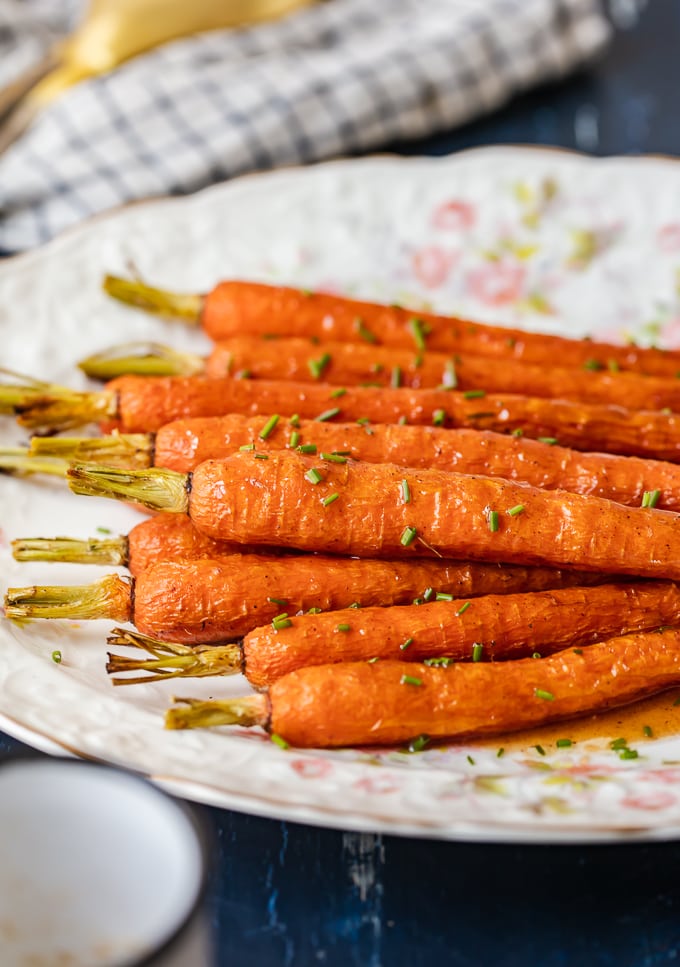 Glazed carrots on a serving plate sprinkled with chives