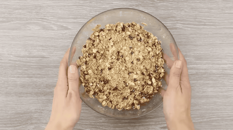 ingredients for healthy peanut butter balls in a glass bowl.