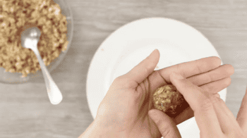 rolling a peanut butter energy ball between hands.