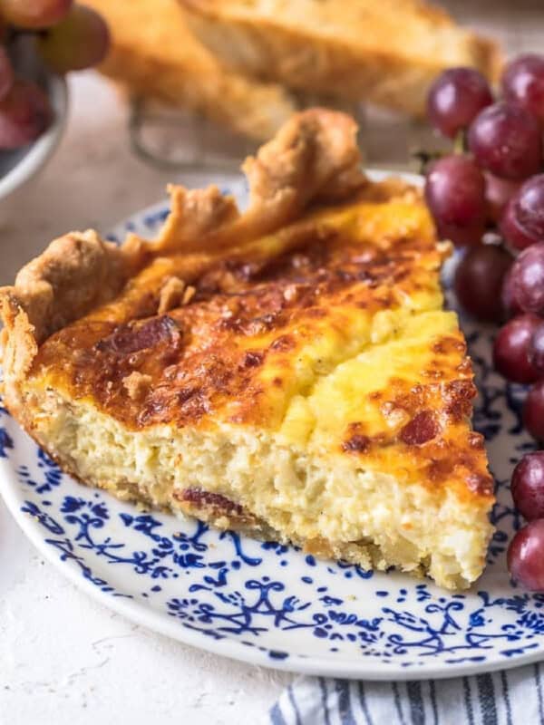 slice of quiche lorraine on a blue plate