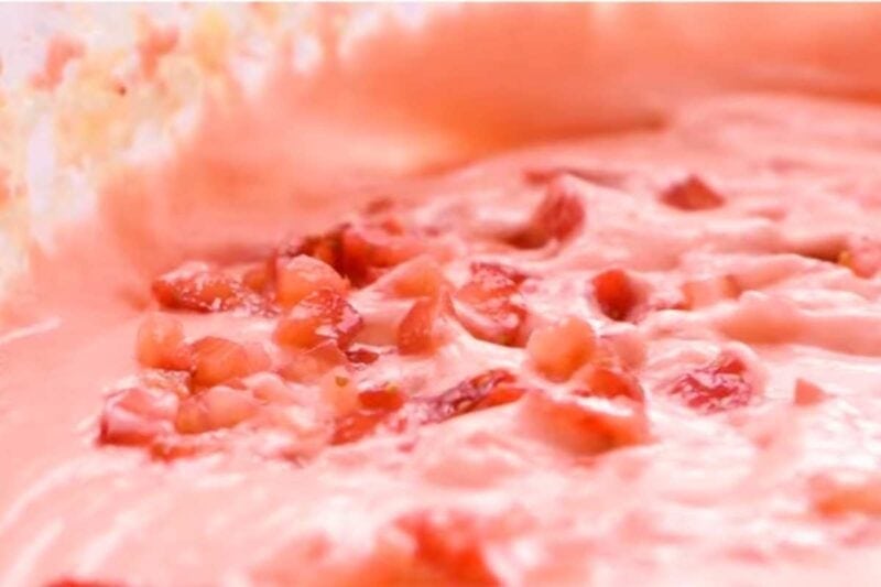 gently folding strawberry in wet mix