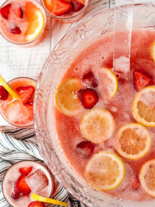 Strawberry Lemonade Party Punch is the best summer punch recipe! This refreshing drink is made with Everclear for the perfect party punch recipe.