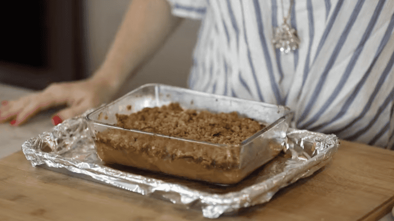 baked apple crisp in a glass baking dish.