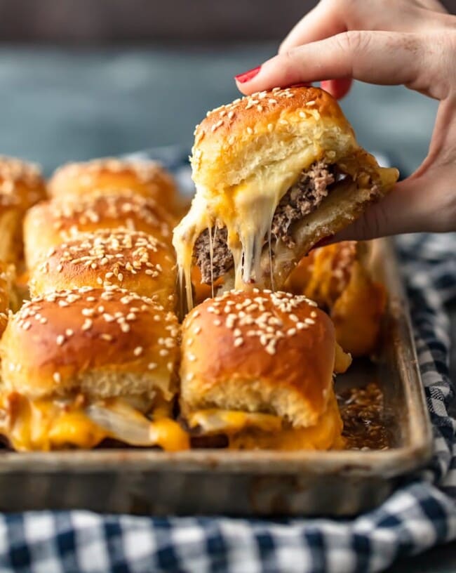 Baked Bacon Cheeseburger Sliders are a fun and easy lunch of dinner perfect for those busy school nights or fun game days! There's nothing better than this EASY Pull Apart Cheeseburger Slider Recipe for feeding a hungry crowd. So much cheese, so little time!