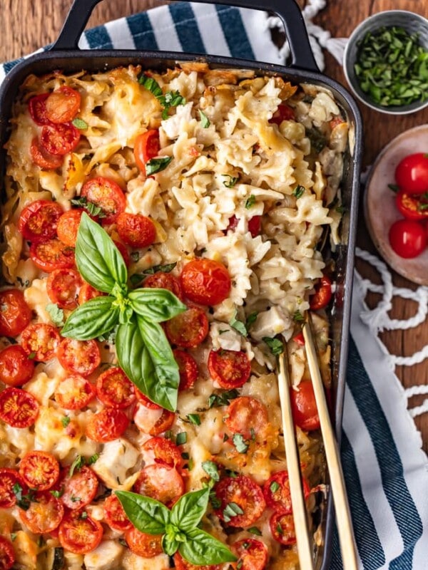 This Chicken Alfredo Pasta Bake is so cheesy, so creamy, and so full of flavor! I love this Chicken Alfredo Casserole for easy weeknight dinners. It's filled with chicken, cheese, tomatoes, pasta, and vegetables, and cooked in a creamy Alfredo sauce. I can't get enough of this Chicken Alfredo Bake!