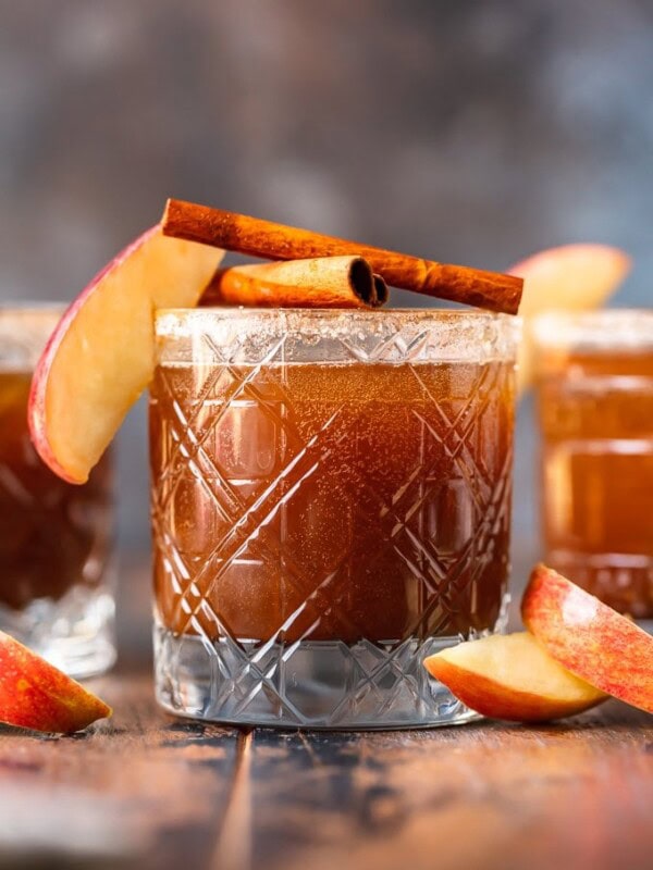 apple butter old fashioned in glass garnished with apple and cinnamon