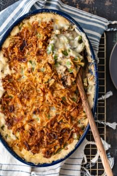 Classic Green Bean Casserole is one of those Thanksgiving recipes that you don't need to reinvent. It's absolutely perfect just the way it is, with green beans, cream of mushroom, crunchy fried onions, and some other awesome ingredients. This green bean casserole recipe is exactly what you need for you next holiday meal!